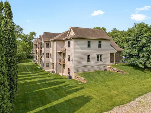 691 N River St Unit 1, Merrimac, WI 53561 - view of side of property with a lawn, central AC, and roof with shingles