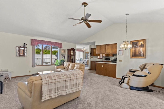636 Westbury Ln Unit 12, Delavan, WI 53115 - carpeted living room featuring a chandelier, ceiling fan, baseboards, and high vaulted ceiling