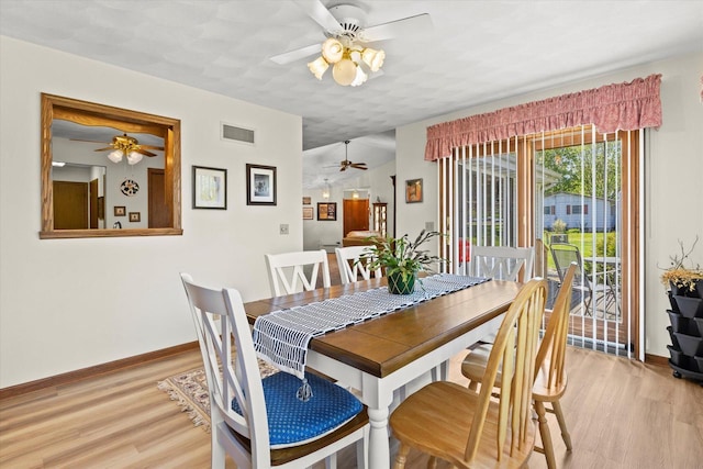 636 Westbury Ln Unit 12, Delavan, WI 53115 - dining room with a ceiling fan, light wood finished floors, and baseboards