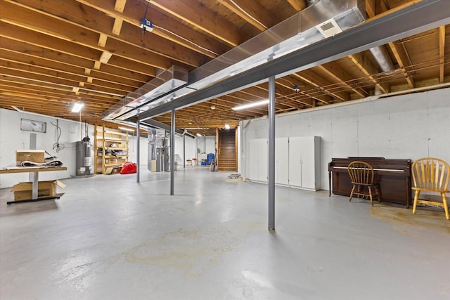 636 Westbury Ln Unit 12, Delavan, WI 53115 - unfinished below grade area featuring heating unit and gas water heater