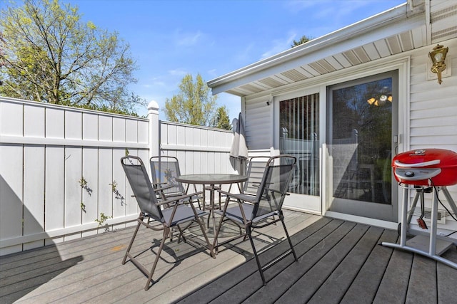636 Westbury Ln Unit 12, Delavan, WI 53115 - wooden terrace with outdoor dining space and grilling area