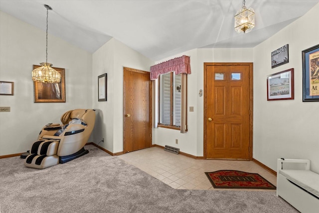 636 Westbury Ln Unit 12, Delavan, WI 53115 - tiled entryway with a chandelier, baseboards, lofted ceiling, and carpet