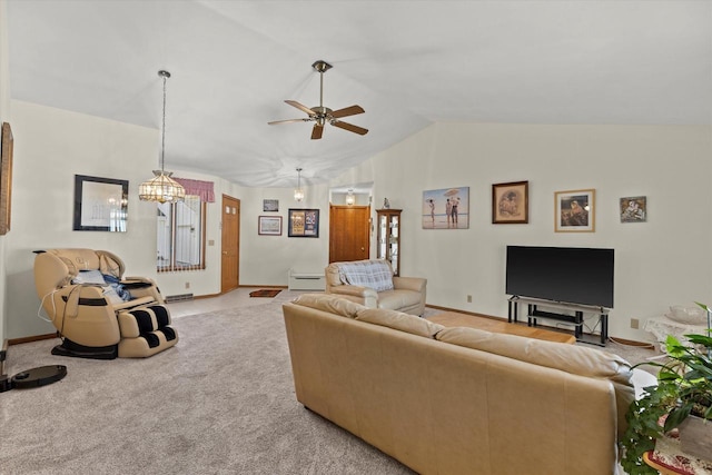 636 Westbury Ln Unit 12, Delavan, WI 53115 - carpeted living area with vaulted ceiling, a ceiling fan, a chandelier, and baseboards