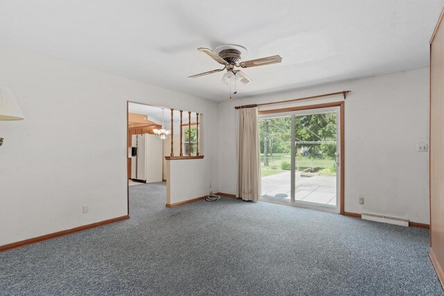 11549 N Meadowbrook Dr, Mequon, WI 53097 - carpeted empty room with baseboards, ceiling fan, and a chandelier