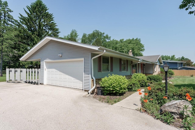 11549 N Meadowbrook Dr, Mequon, WI 53097 - single story home featuring a garage, a chimney, and driveway