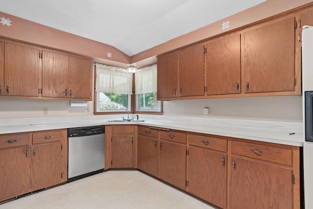 11549 N Meadowbrook Dr, Mequon, WI 53097 - kitchen with stainless steel dishwasher, a sink, vaulted ceiling, light countertops, and light flooring