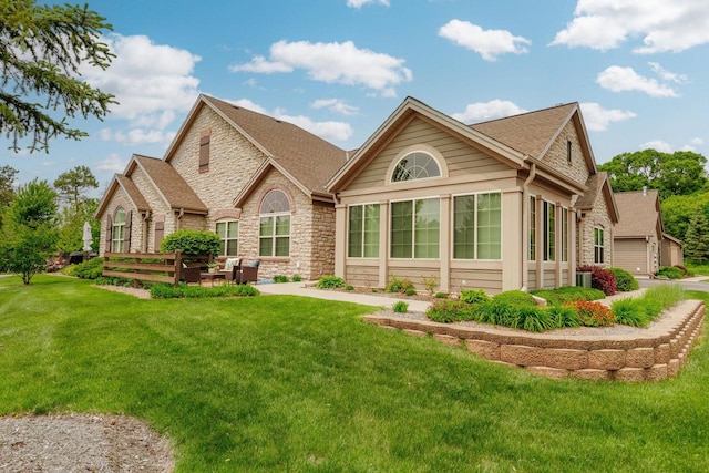 15370 Huff Way, Brookfield, WI 53005 - back of property with stone siding, a lawn, and a shingled roof