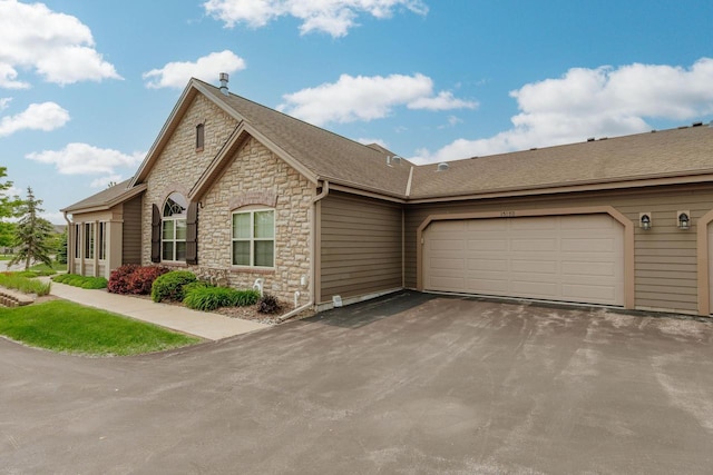 15370 Huff Way, Brookfield, WI 53005 - view of front of house with stone siding, driveway, and an attached garage