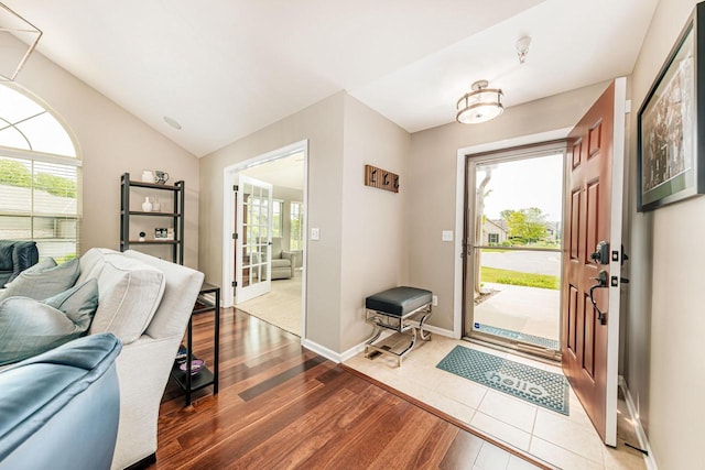 15370 Huff Way, Brookfield, WI 53005 - foyer with wood finished floors, plenty of natural light, lofted ceiling, and baseboards