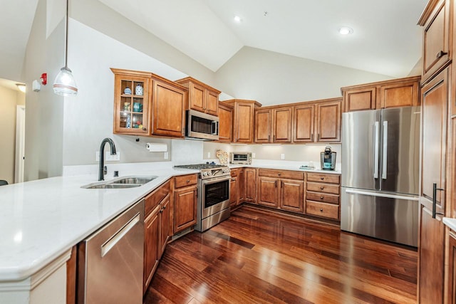 15370 Huff Way, Brookfield, WI 53005 - kitchen featuring stainless steel appliances, a sink, brown cabinetry, a peninsula, and light countertops