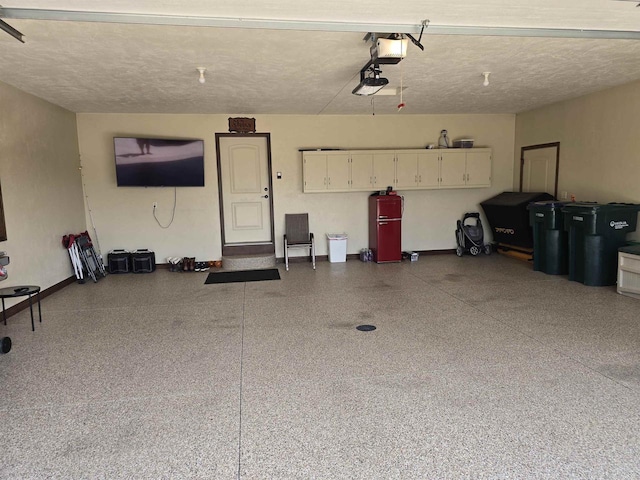 938 W Northstar Dr, Appleton, WI 54913 - garage featuring baseboards and a garage door opener