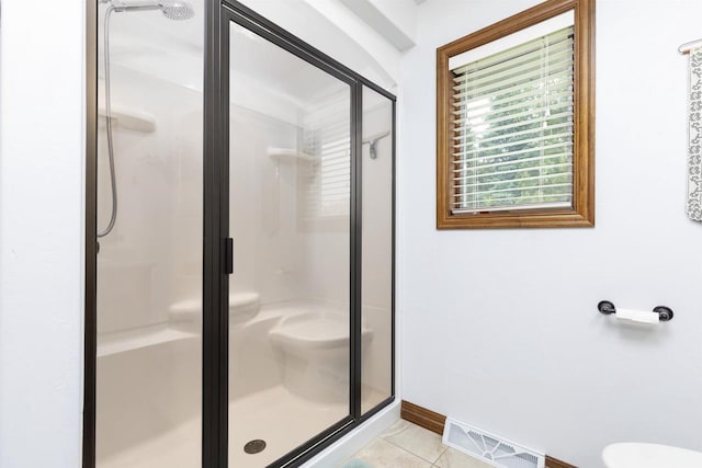 938 W Northstar Dr, Appleton, WI 54913 - bathroom with a shower stall, toilet, tile patterned flooring, and baseboards