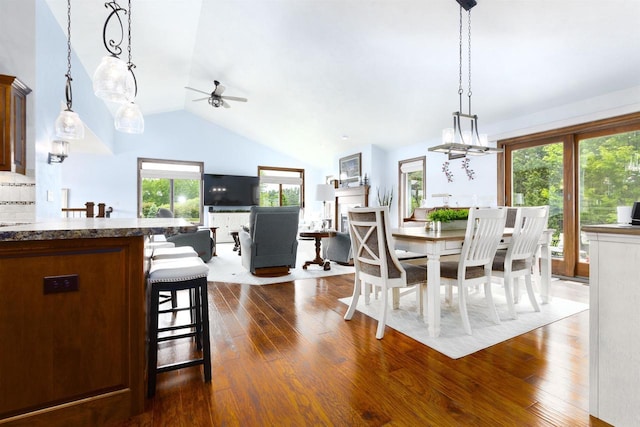 938 W Northstar Dr, Appleton, WI 54913 - dining room with ceiling fan, dark wood-style flooring, and vaulted ceiling