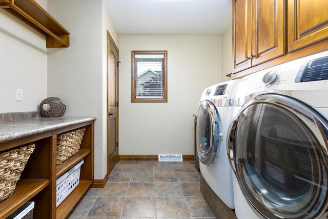 938 W Northstar Dr, Appleton, WI 54913 - laundry area with washer and dryer, cabinet space, and baseboards
