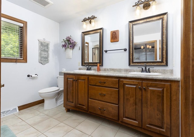938 W Northstar Dr, Appleton, WI 54913 - full bathroom featuring double vanity, tile patterned floors, toilet, and baseboards