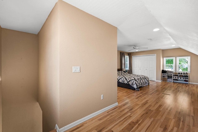 1568 S 63rd St, West Allis, WI 53214 - bedroom featuring baseboards, light wood finished floors, vaulted ceiling, a closet, and recessed lighting
