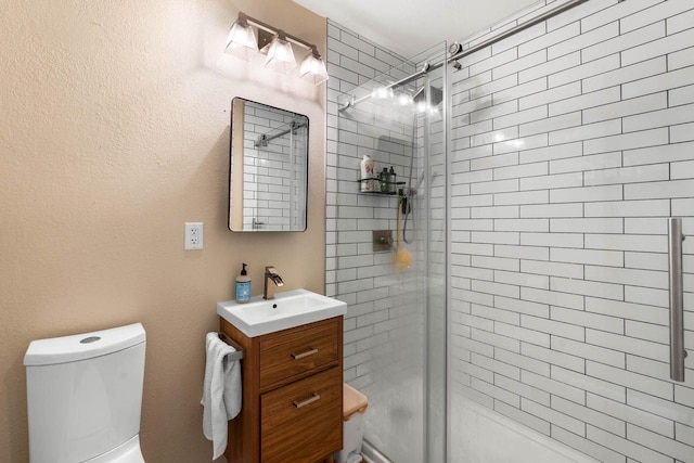 1568 S 63rd St, West Allis, WI 53214 - bathroom featuring vanity, a tile shower, and toilet