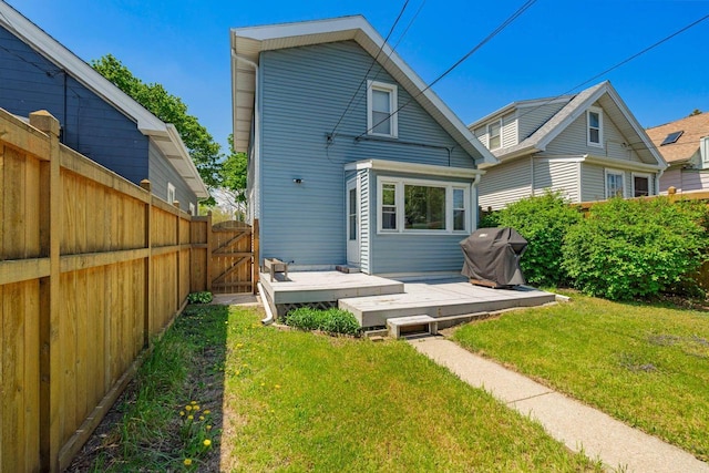 1568 S 63rd St, West Allis, WI 53214 - rear view of property featuring a gate and a deck
