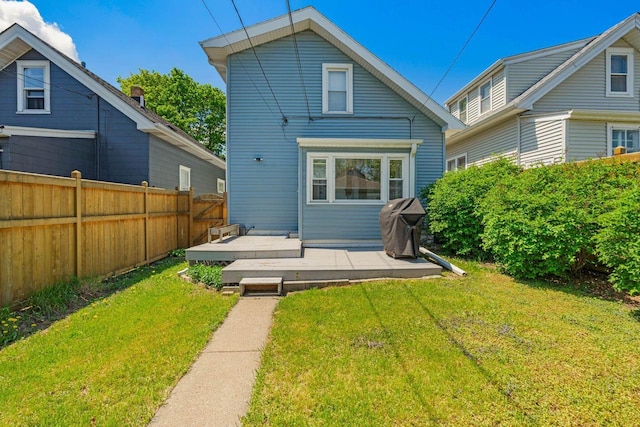 1568 S 63rd St, West Allis, WI 53214 - back of house featuring a wooden deck and a patio area