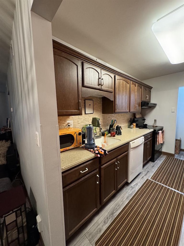 2470 W Good Hope Rd Unit 168, Glendale, WI 53209 - kitchen with stove, stainless steel microwave, white dishwasher, and dark brown cabinets