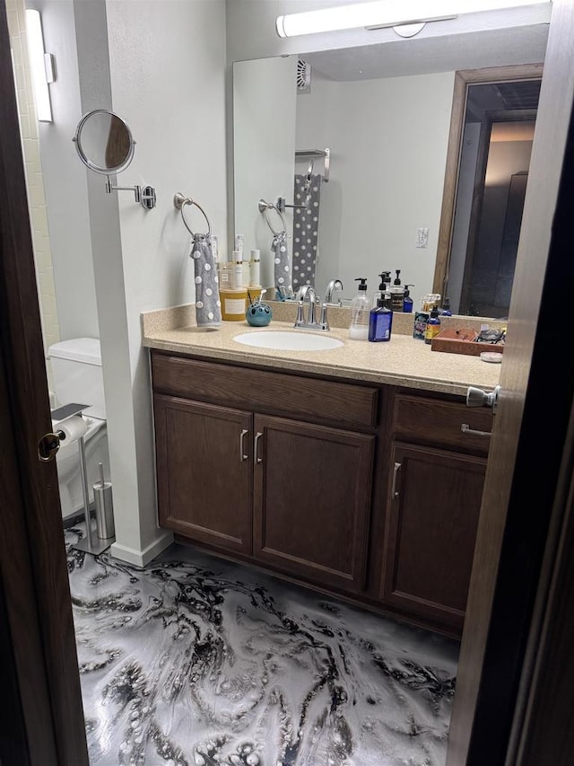 2470 W Good Hope Rd Unit 168, Glendale, WI 53209 - bathroom featuring vanity and toilet