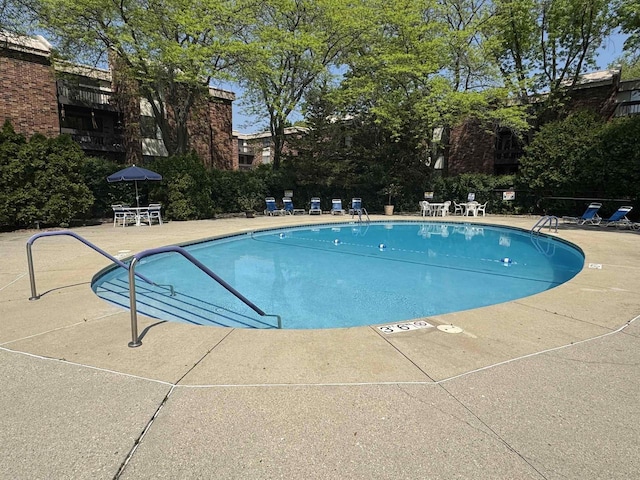 2470 W Good Hope Rd Unit 168, Glendale, WI 53209 - community pool featuring a patio