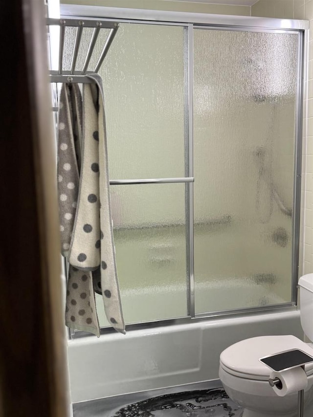 2470 W Good Hope Rd Unit 168, Glendale, WI 53209 - bathroom with toilet and bath / shower combo with glass door