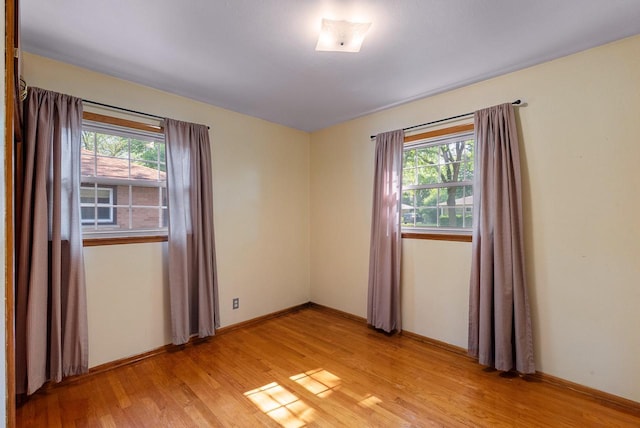 2943 S 102nd St, West Allis, WI 53227 - unfurnished room featuring healthy amount of natural light and light wood-style flooring