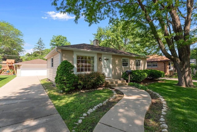 2943 S 102nd St, West Allis, WI 53227 - view of front of house with a chimney, a front lawn, a detached garage, and an outbuilding