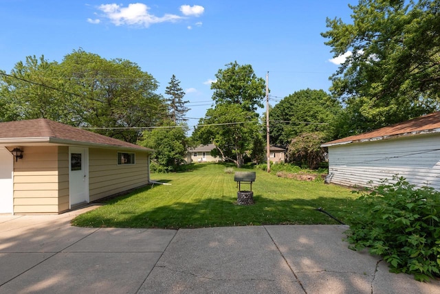 2943 S 102nd St, West Allis, WI 53227 - view of green lawn featuring a patio and an outdoor structure