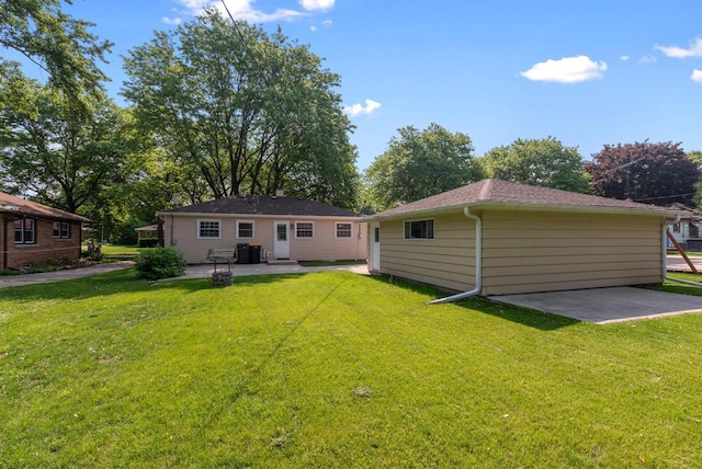 2943 S 102nd St, West Allis, WI 53227 - rear view of house with a patio, cooling unit, and a lawn
