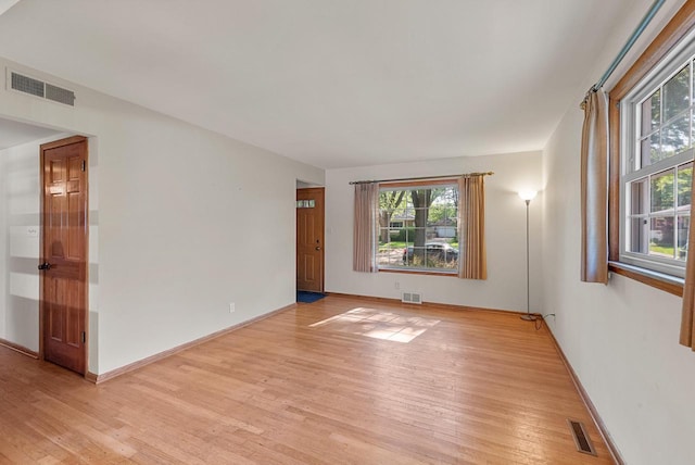 2943 S 102nd St, West Allis, WI 53227 - unfurnished room with light wood-style floors and baseboards
