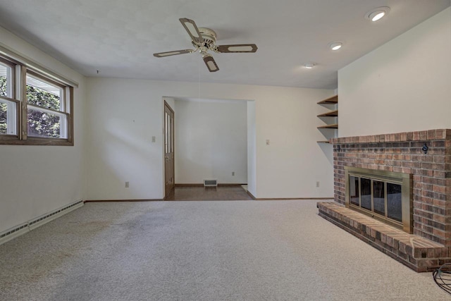 1016 E Marnie Ln, Appleton, WI 54911 - unfurnished living room featuring baseboard heating, a fireplace, carpet, ceiling fan, and baseboards