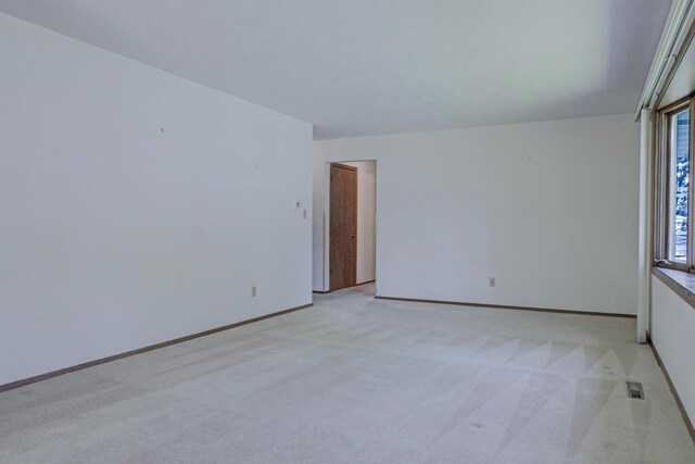 1016 E Marnie Ln, Appleton, WI 54911 - spare room with light carpet and baseboards