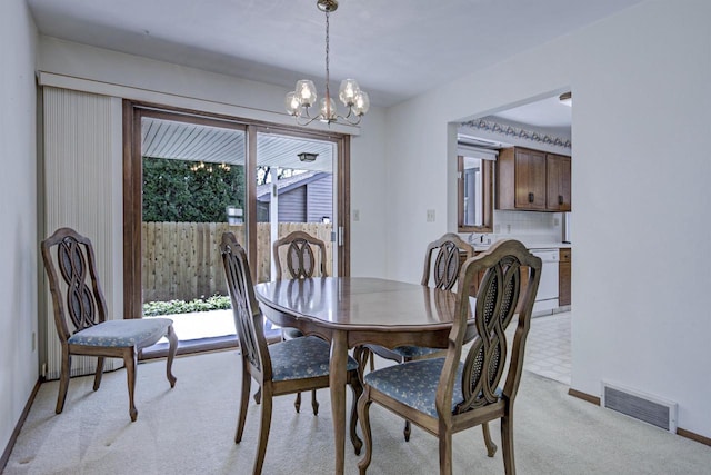 1016 E Marnie Ln, Appleton, WI 54911 - dining space featuring a chandelier, light colored carpet, and baseboards