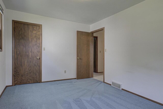 1016 E Marnie Ln, Appleton, WI 54911 - unfurnished bedroom featuring carpet and baseboards