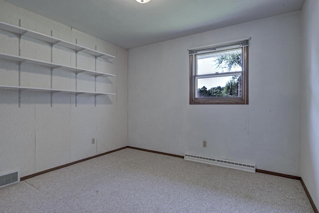 1016 E Marnie Ln, Appleton, WI 54911 - carpeted empty room featuring a baseboard heating unit and baseboards