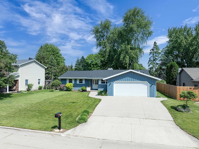 1016 E Marnie Ln, Appleton, WI 54911 - ranch-style house with board and batten siding, an attached garage, and concrete driveway