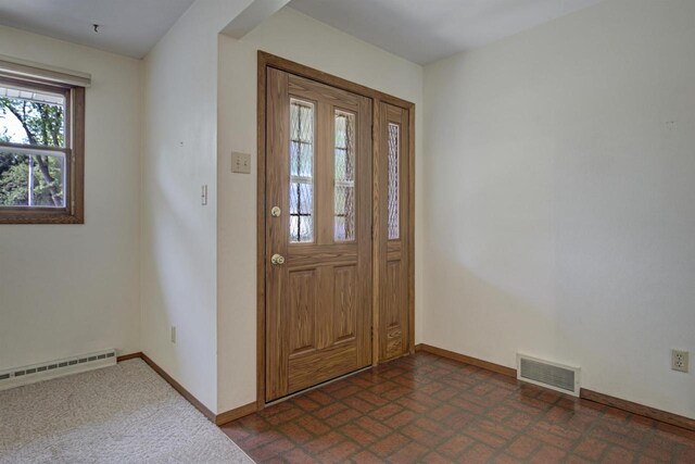 1016 E Marnie Ln, Appleton, WI 54911 - entryway featuring a baseboard heating unit, baseboards, and brick patterned floors