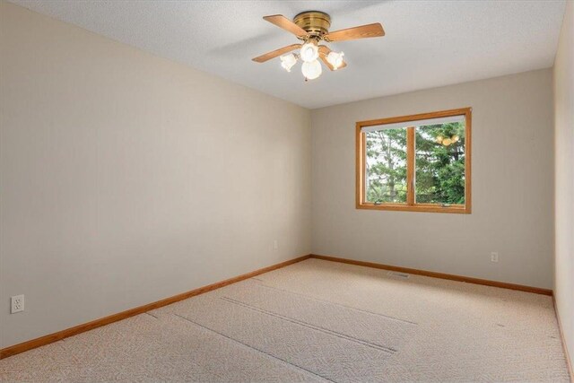 1102 Highpoint Ct, New Richmond, WI 54017 - carpeted empty room with a ceiling fan and baseboards