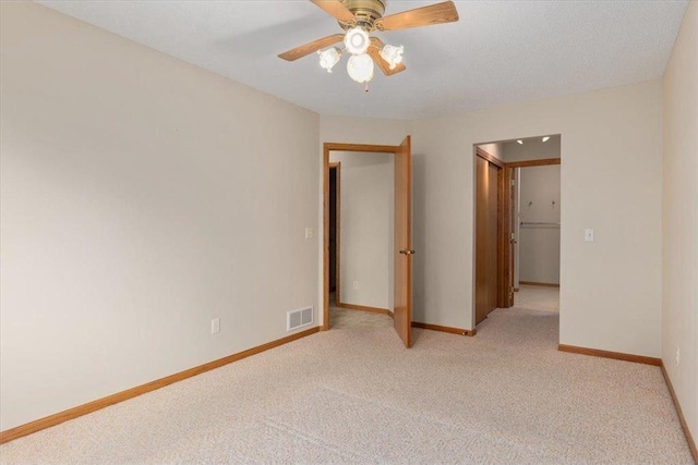 1102 Highpoint Ct, New Richmond, WI 54017 - empty room featuring light carpet, ceiling fan, and baseboards