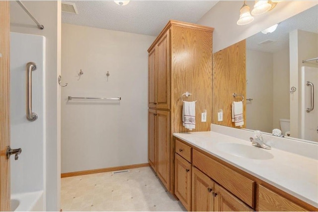 1102 Highpoint Ct, New Richmond, WI 54017 - full bathroom with vanity, toilet, baseboards, shower / bath combination, and a textured ceiling