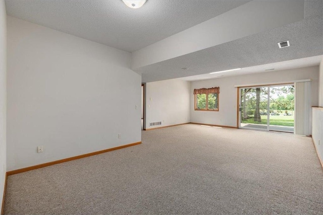 1102 Highpoint Ct, New Richmond, WI 54017 - empty room with carpet flooring, a textured ceiling, and baseboards