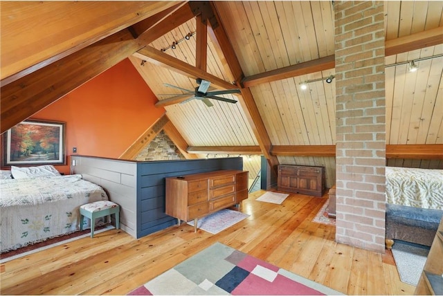 W11333 862nd St, River Falls, WI 54022 - bedroom featuring hardwood / wood-style flooring, decorative columns, wooden ceiling, and rail lighting