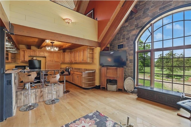 W11333 862nd St, River Falls, WI 54022 - kitchen with open shelves, light wood-type flooring, beam ceiling, a chandelier, and brown cabinets