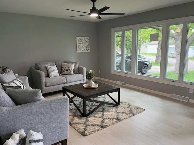 233 Inlet Shores Dr, Delavan, WI 53115 - living area with plenty of natural light, baseboards, and a ceiling fan