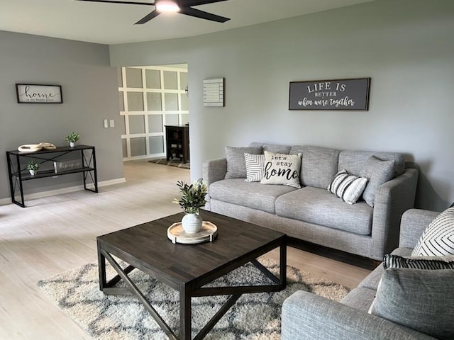 233 Inlet Shores Dr, Delavan, WI 53115 - living area featuring a ceiling fan, wood finished floors, and baseboards