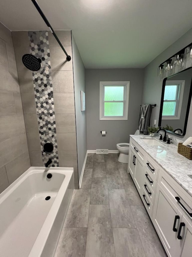 233 Inlet Shores Dr, Delavan, WI 53115 - bathroom with vanity, healthy amount of natural light, toilet, and  shower combination