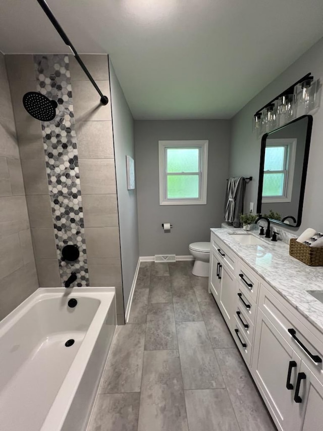 233 Inlet Shores Dr, Delavan, WI 53115 - bathroom featuring double vanity, baseboards, toilet, and bathing tub / shower combination