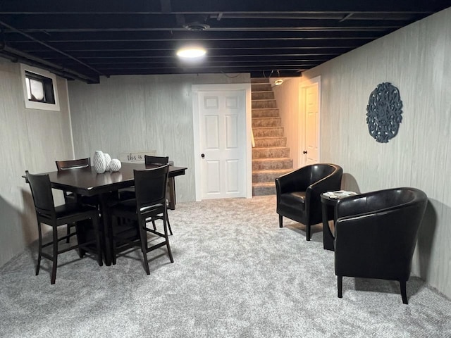 233 Inlet Shores Dr, Delavan, WI 53115 - carpeted dining space with stairs and wood walls